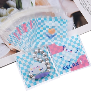 Blue checkerboard self-sealing bags with cartoon flowers and jewelry storage display