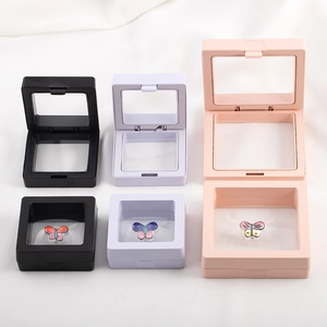 Zwevende presentatiedozen van PE-folie in roze, zwart en wit voor sieraden