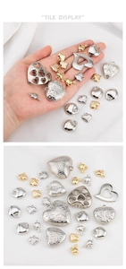 Detailed view of assorted gold and silver CCB heart pendants for DIY jewelry making