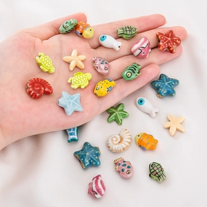 Hand-painted colorful ceramic beads in fish, starfish and turtle shapes for DIY jewelry