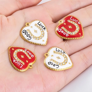 Gold horseshoe heart pendants with Good Luck engraving and sparkling micro-inlaid crystals