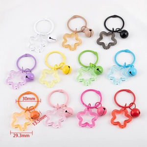 Colorful acrylic star keychains with matching bells and metal rings in eleven vibrant shades