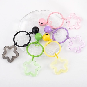 Colorful pentagram star keychains with bells and rings in vibrant dopamine shades