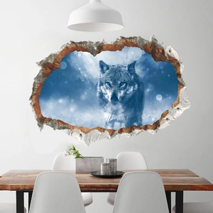 3D broken wall sticker featuring a grey wolf with blue eyes in a snowy forest decor