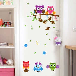 Colorful cartoon owl wall decals kit for kids room decoration on white wooden door surface