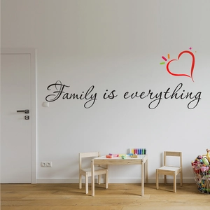Detail of self-adhesive Family is everything wall decal with a heart in a cozy room