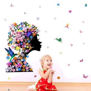 Vibrant wall decal set featuring a floral fairy silhouette with colorful hummingbirds and butterflies