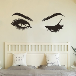 Adesivo murale ciglia nere minimaliste in una camera da letto moderna