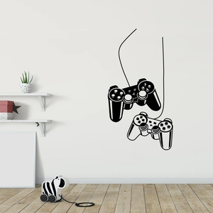 Détail des stickers muraux manette de jeu vidéo dans une décoration de chambre d'enfant