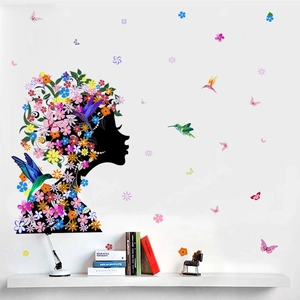 Artistic wall sticker featuring female silhouette with colorful flowers and butterflies