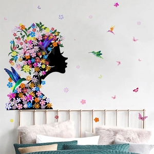 Artistic girl silhouette wall sticker with colorful floral hair and flying butterflies