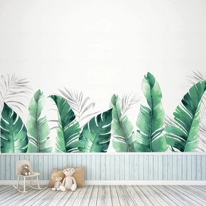 Détail d'autocollants muraux feuilles de bananier tropicales et palmier gris déco