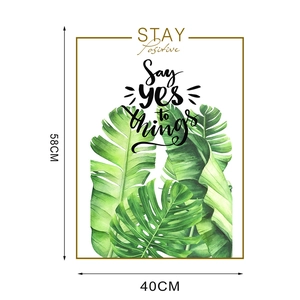 Detail showing tropical green leaf wall art with inspirational quotes measuring 40x58cm