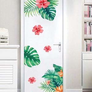 Stickers muraux fleurs d'hibiscus tropicaux et feuilles vertes sur une porte blanche