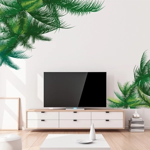 Detail of tropical palm leaf wall decals in hand-painted style for living room decor