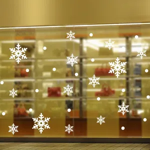 White snowflake window stickers and dots on glass for Christmas festive decoration