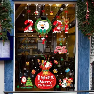 Autocollants de Noël détaillés montrant des rennes colorés et le Père Noël sur vitre