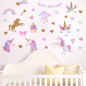 Luminous gold unicorn wall decals with rainbows and stars for a cozy kids' bedroom decor