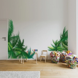 Detailed view of large tropical palm leaf wall decals in a Nordic style living room