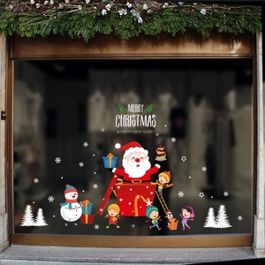 Détail d'autocollants de Noël pour vitres avec Père Noël et vœux sur verre poli