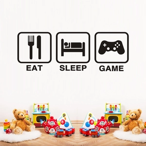 Macro detail of Eat Sleep Game wall stickers featuring controller and cutlery icons