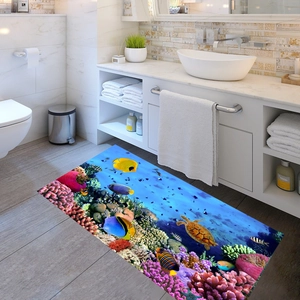 Macro view of 3D marine themed bathroom floor mat with turtles and coral reef pattern