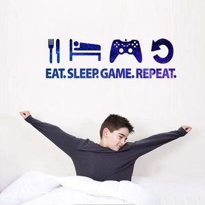 Space-themed wall sticker featuring Eat Sleep Game Repeat text for bedroom decor