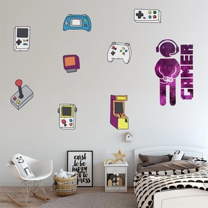 Detail view of colorful gamer wall decals with controllers and astronauts in a nursery room