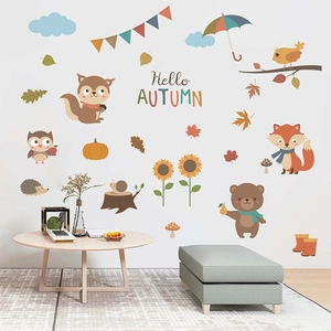 Detail of autumn animal wall stickers featuring a fox, bear, and squirrel on a white wall