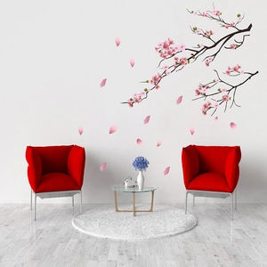 Detailed wall sticker showing cherry blossom branches and pink petals in a modern living room