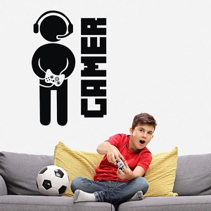 Gamer wall decal with controller silhouette and boy playing games in bedroom setting