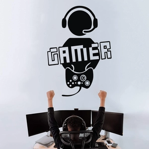 Close-up of gamer wall decal featuring a headset silhouette and controller on a white wall
