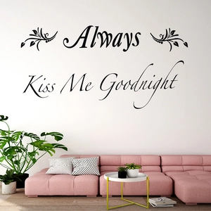 Modern black Always Kiss Me Goodnight wall decal above a sofa for bedroom decor