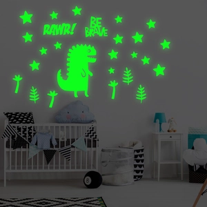 Luminous cartoon dinosaur wall stickers glowing in dark nursery room with stars