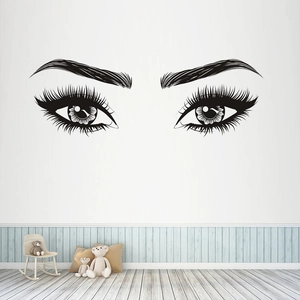 Minimalist black wall sticker featuring elegant female eye outline with long lashes
