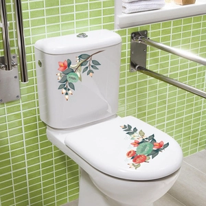 Vue détaillée d'autocollants de toilette floraux étanches avec fleurs rouges et jaunes