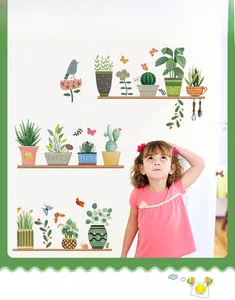 Detail of hand-painted potted plant wall stickers featuring butterflies and green leaves