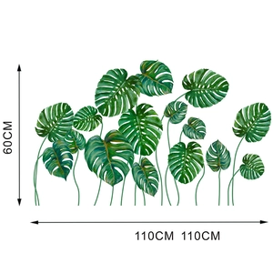 Detailed dimension layout showing green monstera leaf wall decals measuring 110x60 cm