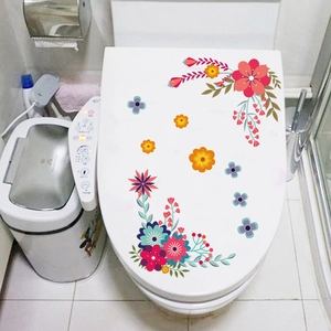 Stickers floraux étanches en PVC sur un abattant de WC blanc pour décoration de salle