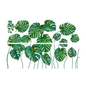 Detailed view of tropical green monstera leaf wall stickers on a clean white background