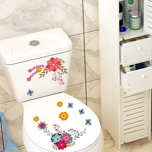 Gros plan détaillé de stickers floraux colorés en PVC sur une surface en céramique