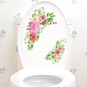 Détail des stickers floraux aquarelle pour abattant WC avec pivoines et feuilles vertes