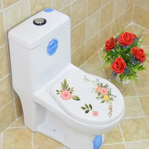 Détail des autocollants floraux roses pour abattant de WC avec motifs de feuilles