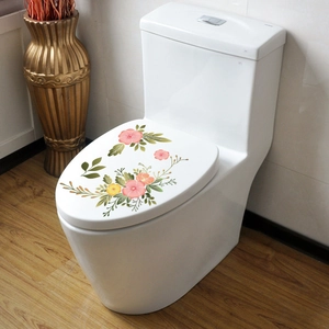 Détail des stickers WC fleurs peintes à la main avec fleurs roses sur abattant blanc