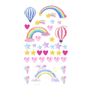 Detail of unicorn rainbow wall stickers with watercolor clouds and golden glitter stars