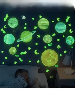 Luminous solar system wall stickers featuring glowing planets and stars in a kids room
