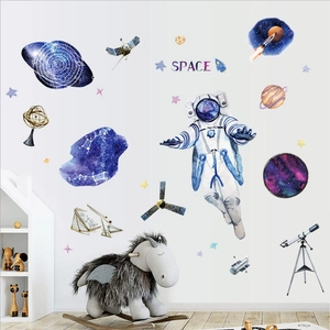 Space themed watercolor wall stickers with astronauts and planets for boys bedroom decor