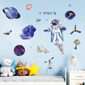 Space themed wall decals featuring watercolor astronauts and planets for boys bedroom decor