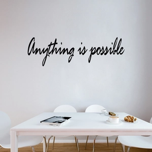 Modern black cursive Anything is Possible wall decal sticker in a minimalist dining room