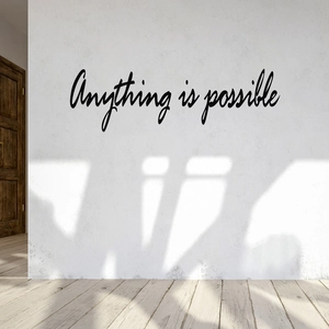 Minimalist black script wall decal featuring the quote Anything is possible on white wall